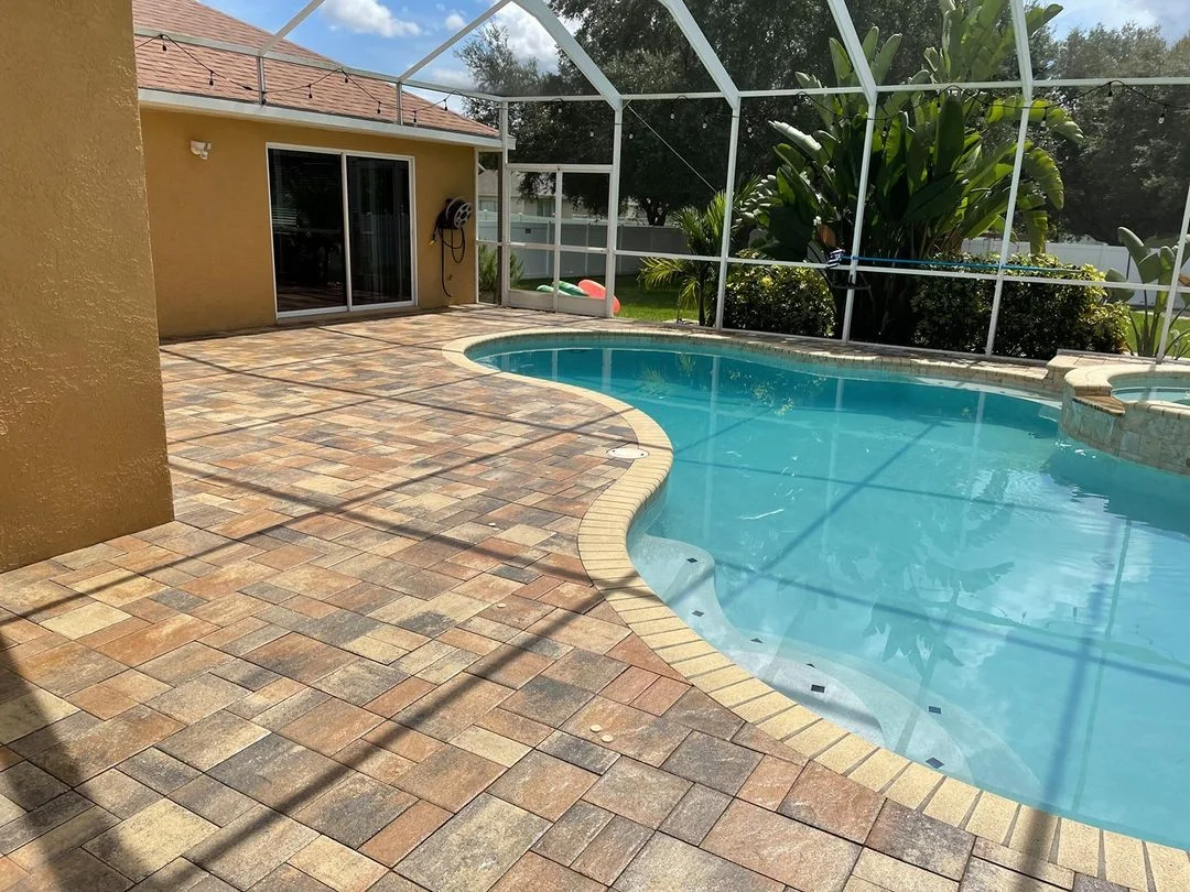 Sealed concrete pavers around pool deck with enhanced color and protection